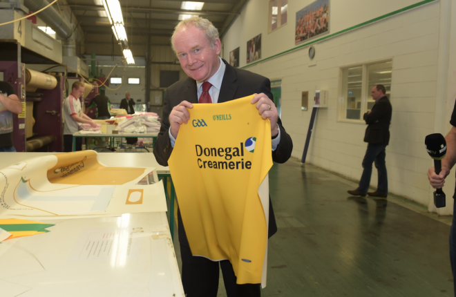 Martin McGuinness with the Donegal jersey he was presented with during a visit to O'Neill's factory in Strabane back in 2014.