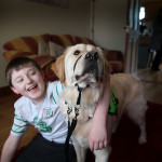 Dermot Connolly with autism therapy dog Lionel.