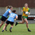 Karen Guthrie in possession against Martha Byrne and Eabha Rutledge, Dublin. Photo: Donna El Assaad