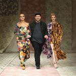 Designer Richard Quinn (C) and models Adwoa Aboah (L) and Jean Campbell (R) are seen on the runway at the Richard Quinn show during London Fashion Week 2018.