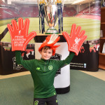 Dannan McGlinchey at Champions Travel with the Premier League Replica Trophy.