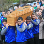 membrs of Cloughaneely GAA Club carry John Harley's remains to St Finian's Church, Falcarragh.