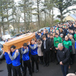 Members of Cloughaneely GAA Club carry John Harley's remains to St Finian's Church, Falcarragh.