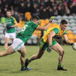 Ciaran Thompson, Donegal is challenged by Donal Keogan, Meath.