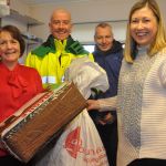 Brid Gallagher and Maureen McConnell handing over the last postal delivery from Dunfanaghy Post Office to Paul Wynn An Post Delivery man on Friday last. Also in the picture is Bill Arnold.